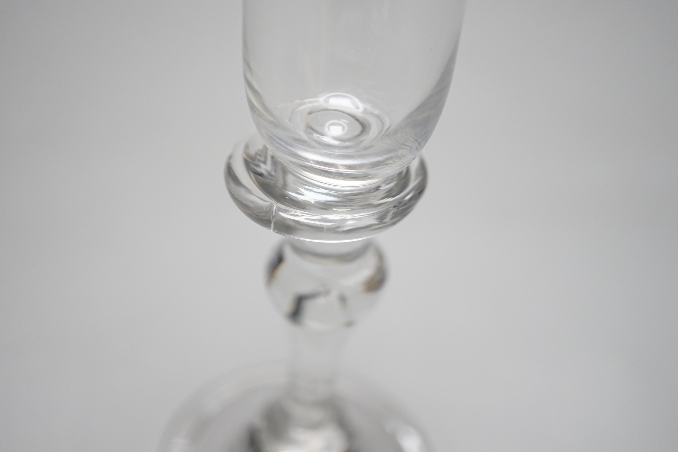 A George II wine glass with inverted teardrop baluster stem, 15.5cm tall